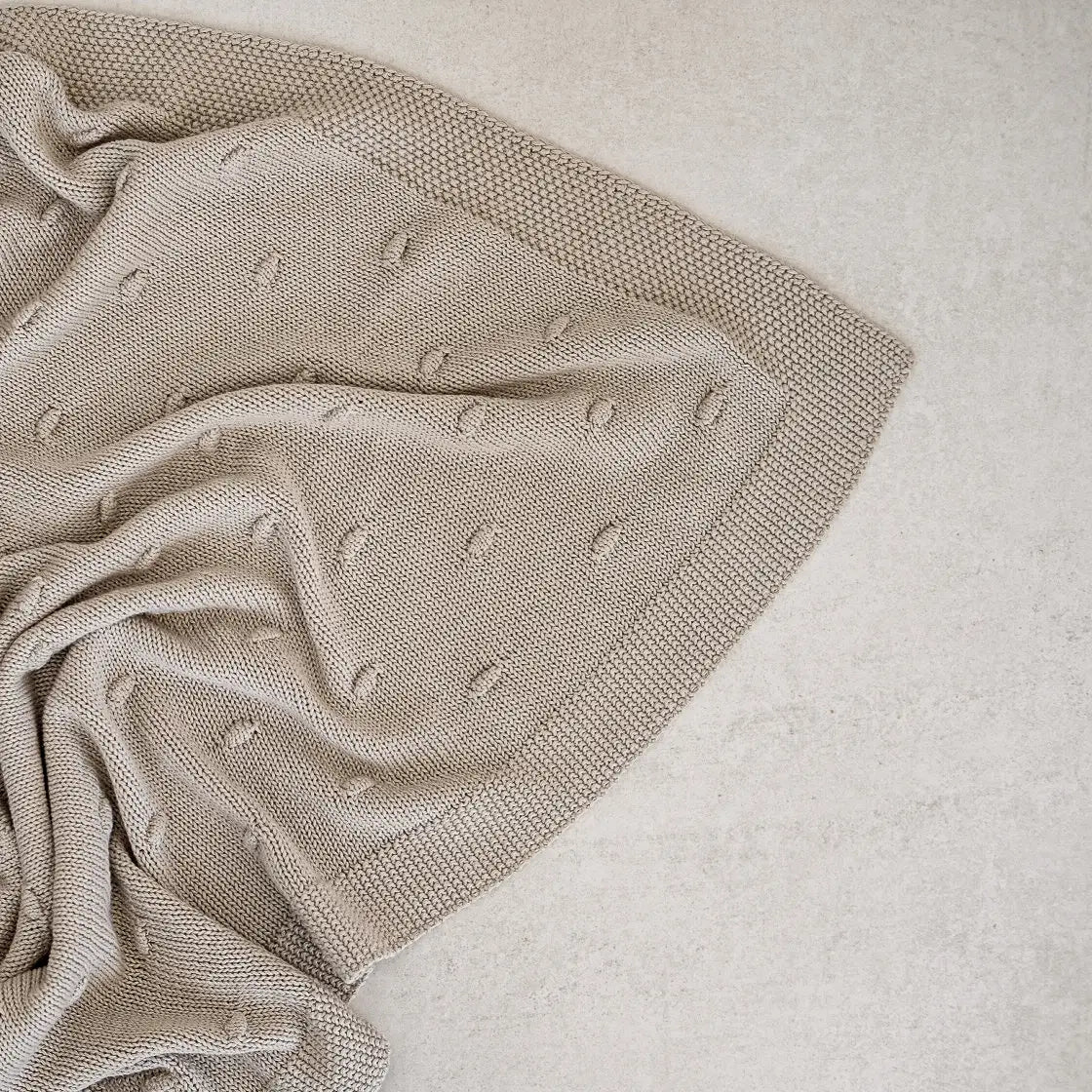 close up of a stone knitted blanket