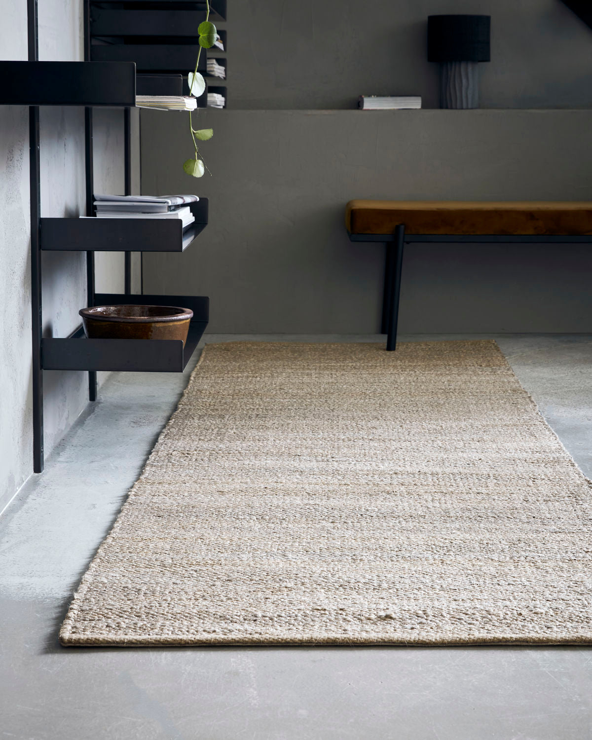 light grey hemp, jute and cotton rug, 300x90cm in an office with shelves and a stool