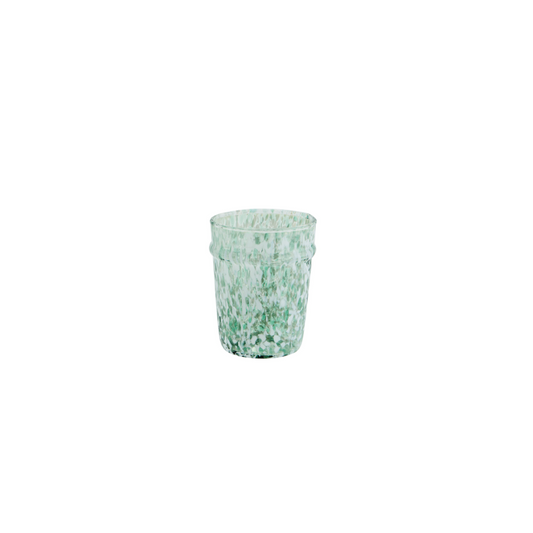 green drinking glass with white speckles