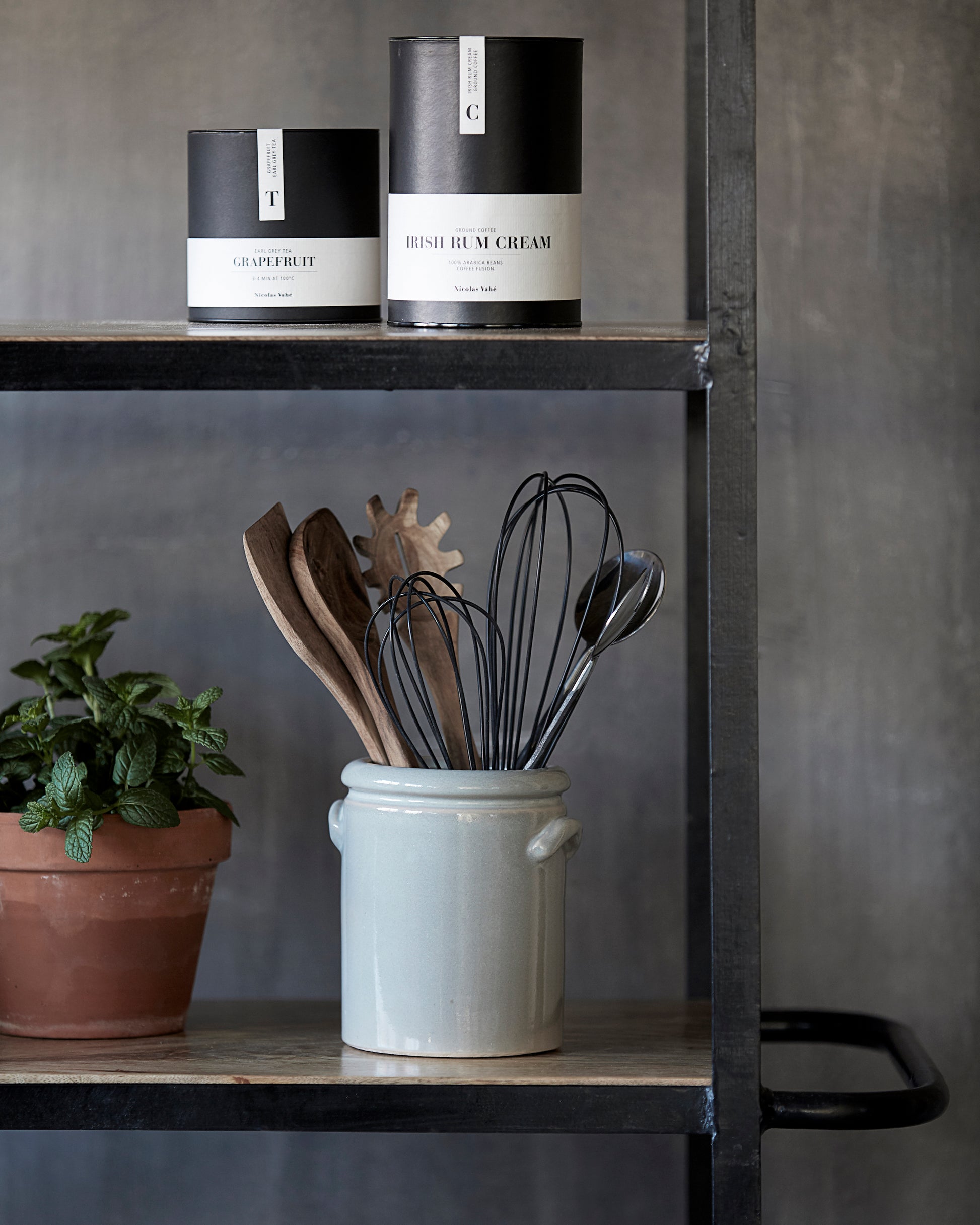 kitchen shelves with utensils in a light grey jar