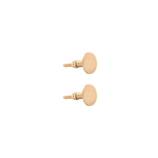 pair of simple gold coloured brass knobs for drawers or cupboards